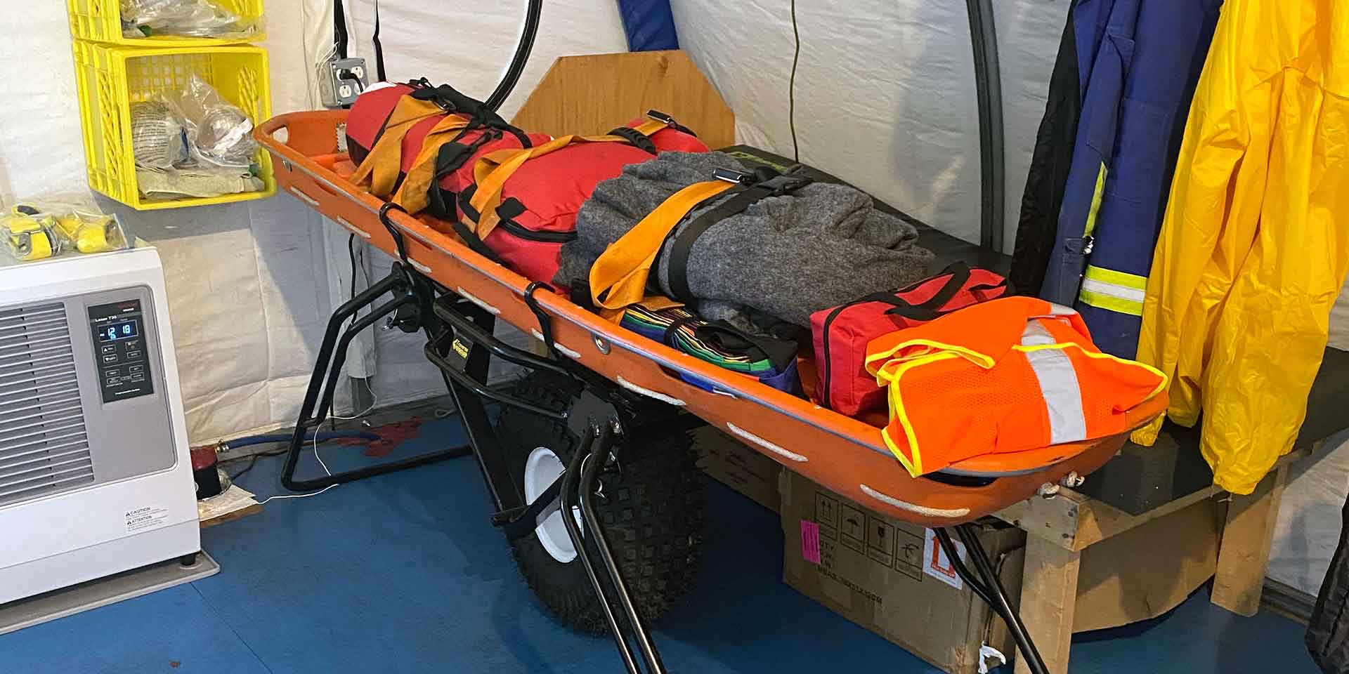 Emergency stretcher with emergency supplies